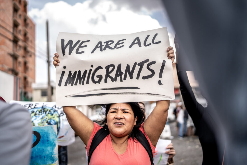 Refugee mature woman protesting in the street